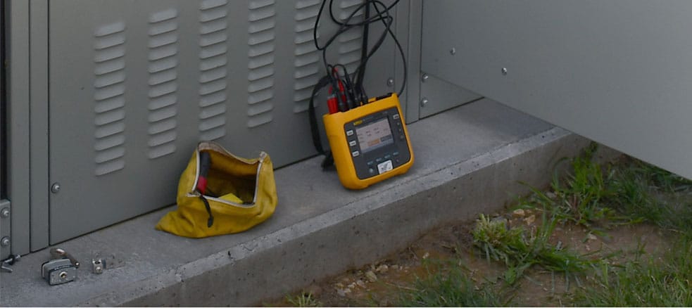 Multimeter sitting next to Electrical box
